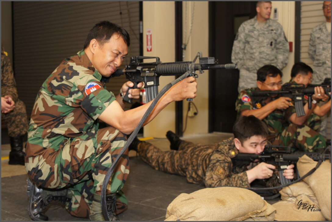 Delegates from the Philippine Air Force, Royal Cambodian Air Force, Royal Lao Air Force, Royal Thai Air Force, Mongolian Air Force and Vietnam People’s Air Force participate in a weapons demonstration here following an instructional period. As part of U.S. Pacific Command’s Theater Security Cooperation Program, a multilateral subject-matter expert exchange co-hosted by senior civil engineer and security forces personnel from Headquarters 13th Air Force concluded here Feb. 23. (U.S. Air Force photo/ Capt. Grant Harwell)