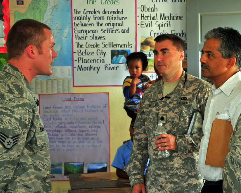 INDEPENDENCE, Belize – U.S. Air Force Staff Sgt. Thomas Delperdang, Medical Element pharmacy NCOIC, explains the pharmacy procedures to Ambassador Vinai Thummalapally, U.S. Ambassador to Belize, and Lt. Col. Lynn, Military Liaison Office, during their site visit to the joint medical readiness training exercise here Feb. 29. (U.S. Air Force photo/Staff Sgt. Bryan Franks)
