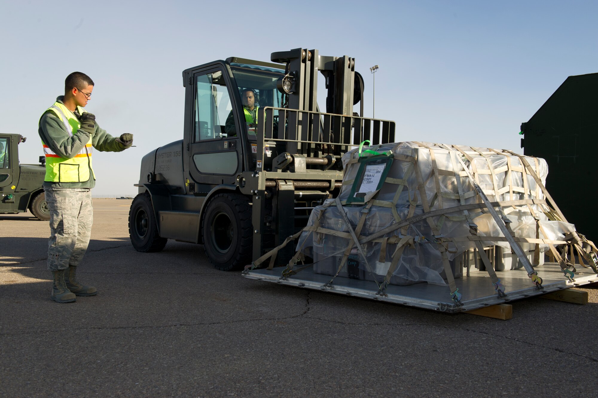 HOLLOMAN AIR FORCE BASE, N.M. – Staff Sgt. Ian Cox-Train, 49th Logistics Readiness Squadron, uses a forklift to load supply crates filled with Airmen’s mobility bags during a Phase One Operational Readiness Exercise Feb. 28.  The bags are filled with readily-deployable items, which are loaded onto diesel trucks for transport to an aircraft heading to the “deployed location” during the ORE. Holloman performs these exercises to ensure that its Airmen are ready at a moment’s notice for real-world situations. (U.S. Air Force photo by Airman 1st Class Michael Shoemaker/Released)