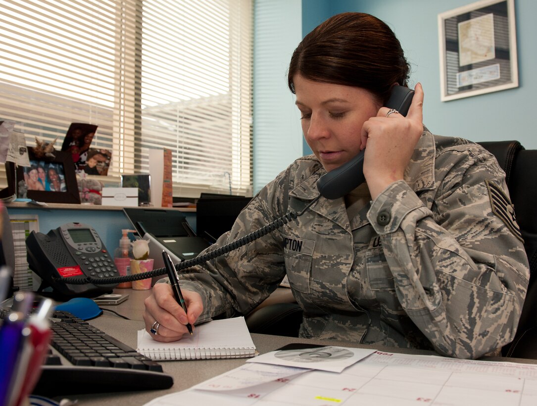 Tech. Sgt. Candice Compton, 28th Bomb Wing Equal Opportunity NCO in charge of human relations education and assessments, records information in the EO office at Ellsworth Air Force Base, S.D., Feb. 21, 2012. Aside from handling reports, EO conducts a variety of training classes to encourage comfortable and mission-focused work centers. (U.S. Air Force photo by Airman 1st Class Kate Thornton/Released)