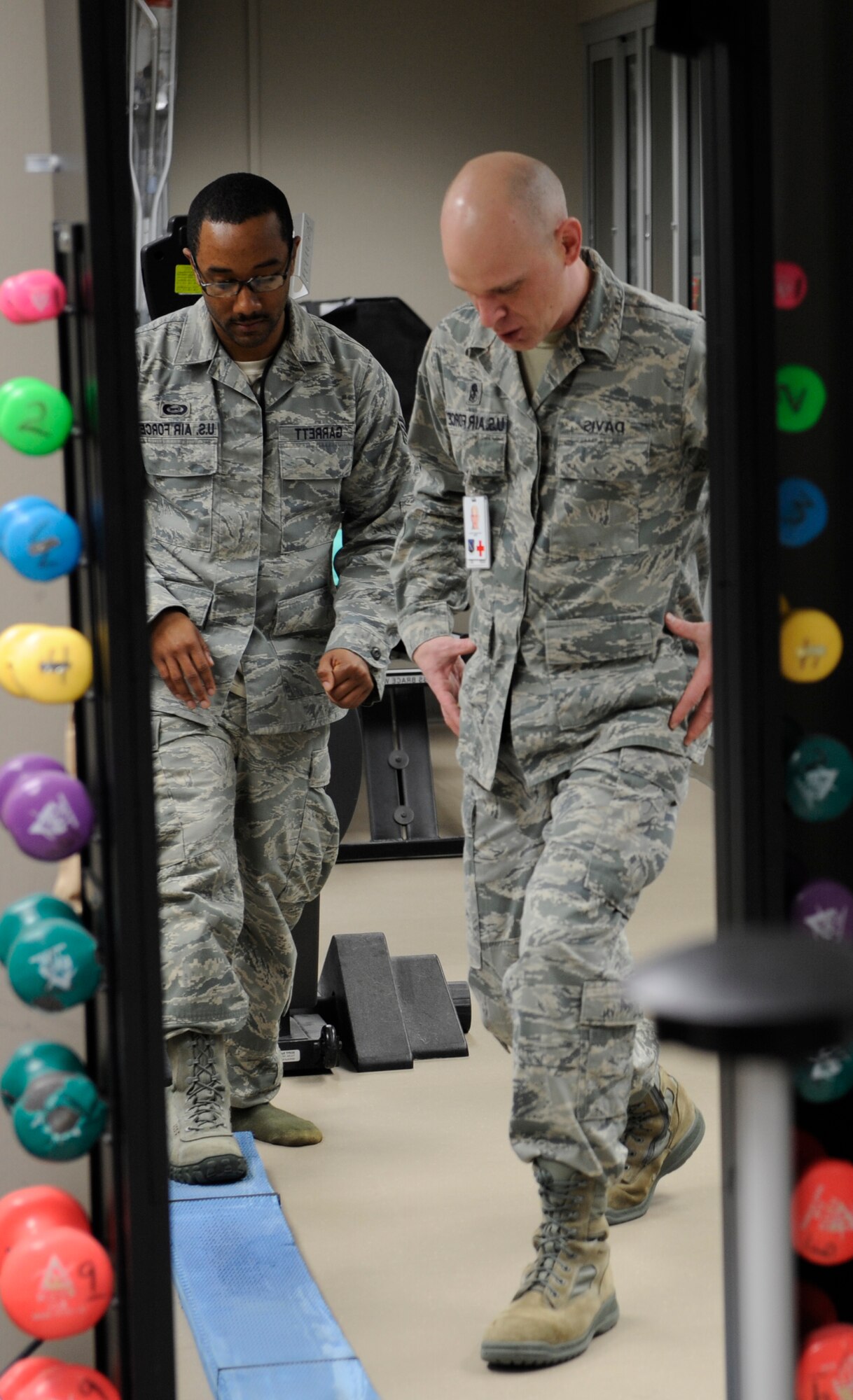 Master Sgt. Daniel Davis, 92nd Medical Squadron NCO in charge, performs an ankle stability function pattern exercise on Staff Sgt. Vincent Garrett, 509th Weapons Squadron, Feb. 10 at the physical therapy clinic. (U.S. Air Force photo by Airman 1st Class Earlandez Young)