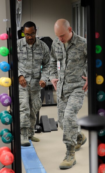 Master Sgt. Daniel Davis, 92nd Medical Squadron NCO in charge, performs an ankle stability function pattern exercise on Staff Sgt. Vincent Garrett, 509th Weapons Squadron, Feb. 10 at the physical therapy clinic. (U.S. Air Force photo by Airman 1st Class Earlandez Young)