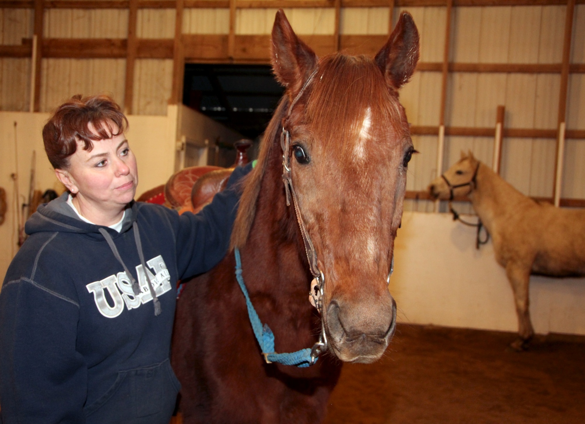 Master Sgt. Shana Cullum and Otee enjoy their day at a training stable near Trenton, Ill.  Cullum and husband, Clint, have been raising, breeding and training horses since 2004.  Cullum is the first sergeant for the 932nd Aerospace Staging Squadron.  Read more about the Cullum family and their horses next week on the 932nd AW official web site. 