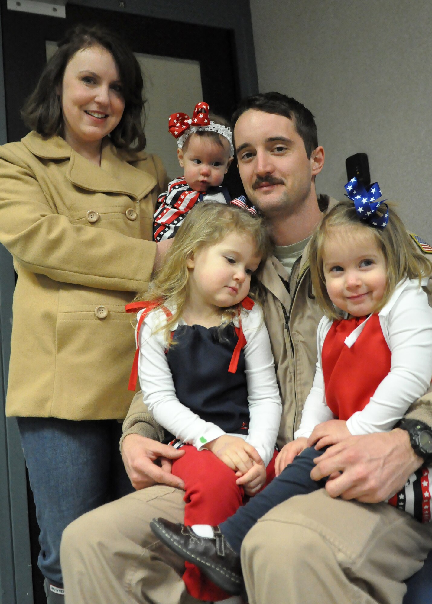 Staff Sgt. John Krisman, 7th Airlift Squadron loadmaster, spends time with his famiy after returning from a deployment Feb. 29, 2012, at Joint Base Lewis-McChord, Wash. “It was great to work with our partners from the National Guard and Air Force Reserve,” said Krisman. “It was a good deployment. We stayed busy and got everything done. It’s great to finally be home.” (U.S. Air Force photo/Airman 1st Class Leah Young)
