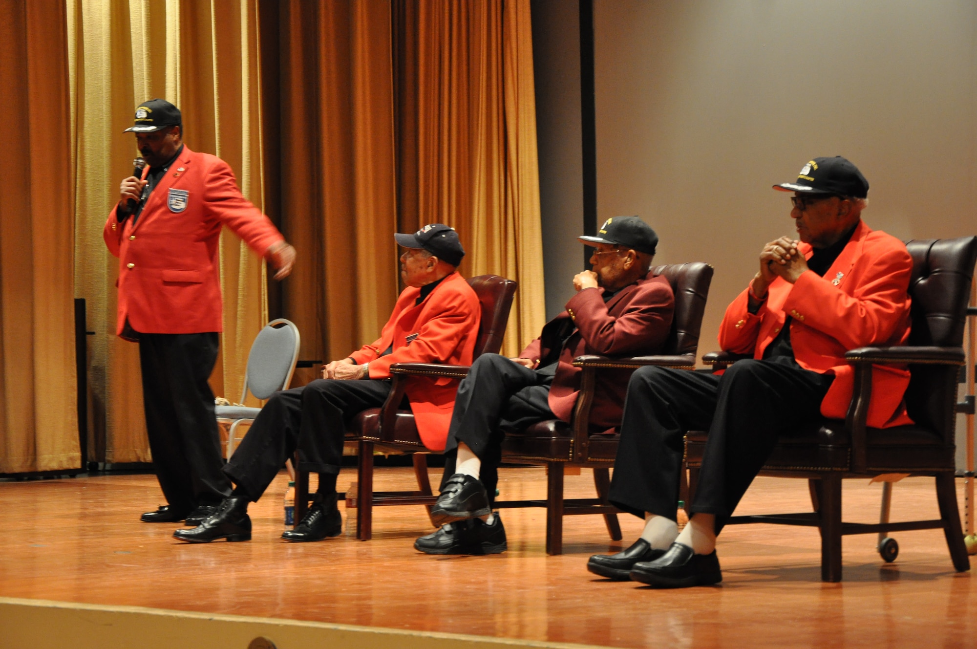 Senior Master Sgt. (Ret.) Walter Suggs (Left), president of a local Tuskegee Airmen Inc. chapter moderates a questions and answer session for three Tuskegee Airmen at the base theater at Beale Air Force Base, Calif., Feb. 24, 2012. The three Airmen attended the Tuskegee Institute in Alabama during World War II. (U.S. Air Force photo by Staff Sgt. Robert M. Trujillo/Released)
