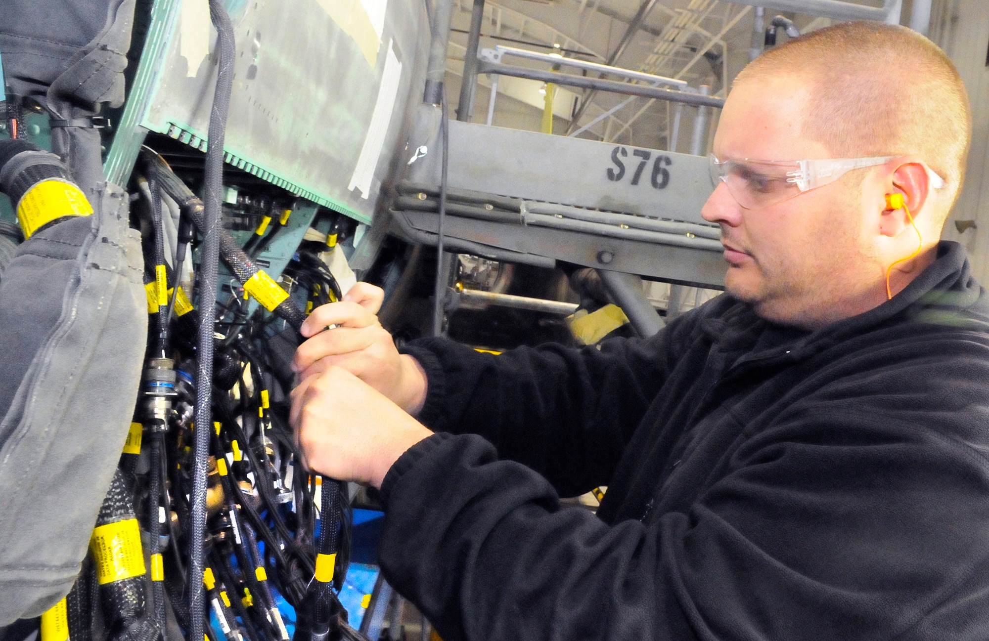 Lee Garvin works on the rewire of an F-15. U. S. Air Force photo by Sue Sapp