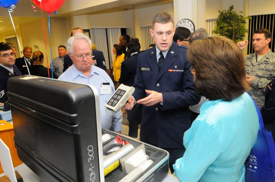 Capt. Eric Bacon, center, 78th AMDS bio engineer, shows Dr. Charlie Dean and Lisa Tanner, Mid Ga OB/GYN and General Health, a radiation detection meter. U. S. Air Force photo by Sue Sapp