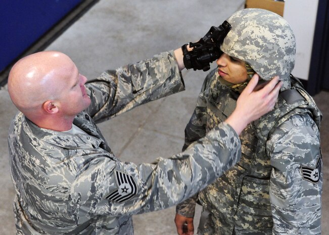 Staff Sgt. Vincent Bustillo and Tech.Sgt. Anthony Waldon inspect mobility gear at the 628th Security Forces Squadron warehouse at Joint Base Charleston - Air Base Feb. 27. 628th SFS personnel are responsible for issuing individual field equipment required for contingency operations and ensuring security forces and unit task code standards are maintained. Bustillo is a 628th SFS vehicle non-commissioned officer in charge and Waldon is a 628th SFS supply NCOIC. (U.S. Air Force photo/Staff Sgt. Katie Gieratz) 





