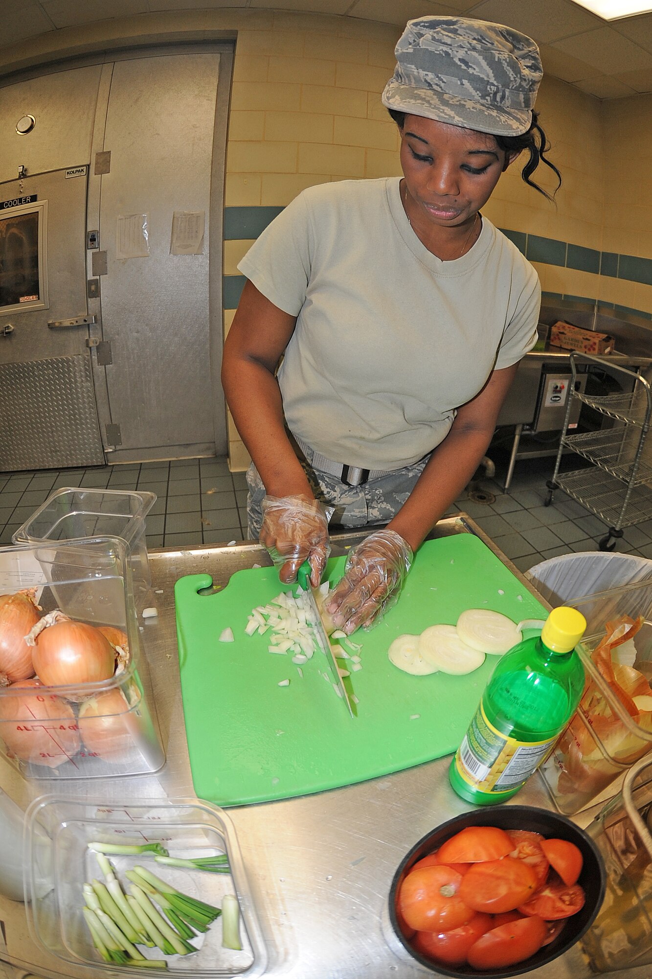 U.S. Air Force Airman 1st Class Sherkona Smith dices vegetables for the salad bar at the Southern Eagle dining facility on Seymour Johnson Air Force Base, N.C., Feb. 28, 2012. The dining facility staff provides healthy meal choices for all patrons. Sherkona, 4th Force Support Squadron food specialist, hails from Wilmington, N.C. (U.S. Air Force photo/Senior Airman Gino Reyes/Released)
