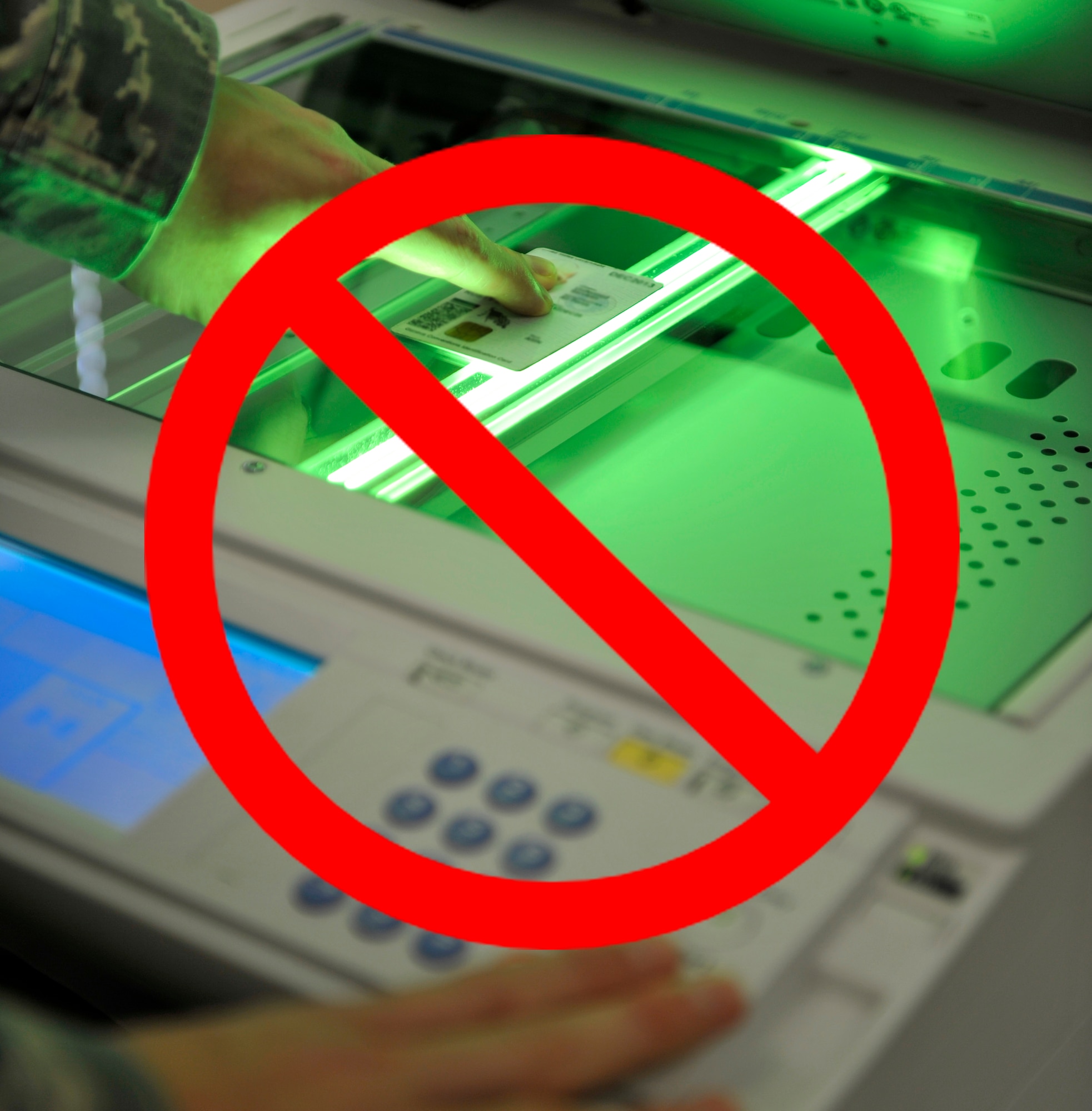 Photocopying CAC cards is illegal and punishable by fine or imprisonment. (U.S. Air Force photo illustration by Senior Airman Caleb Pierce)