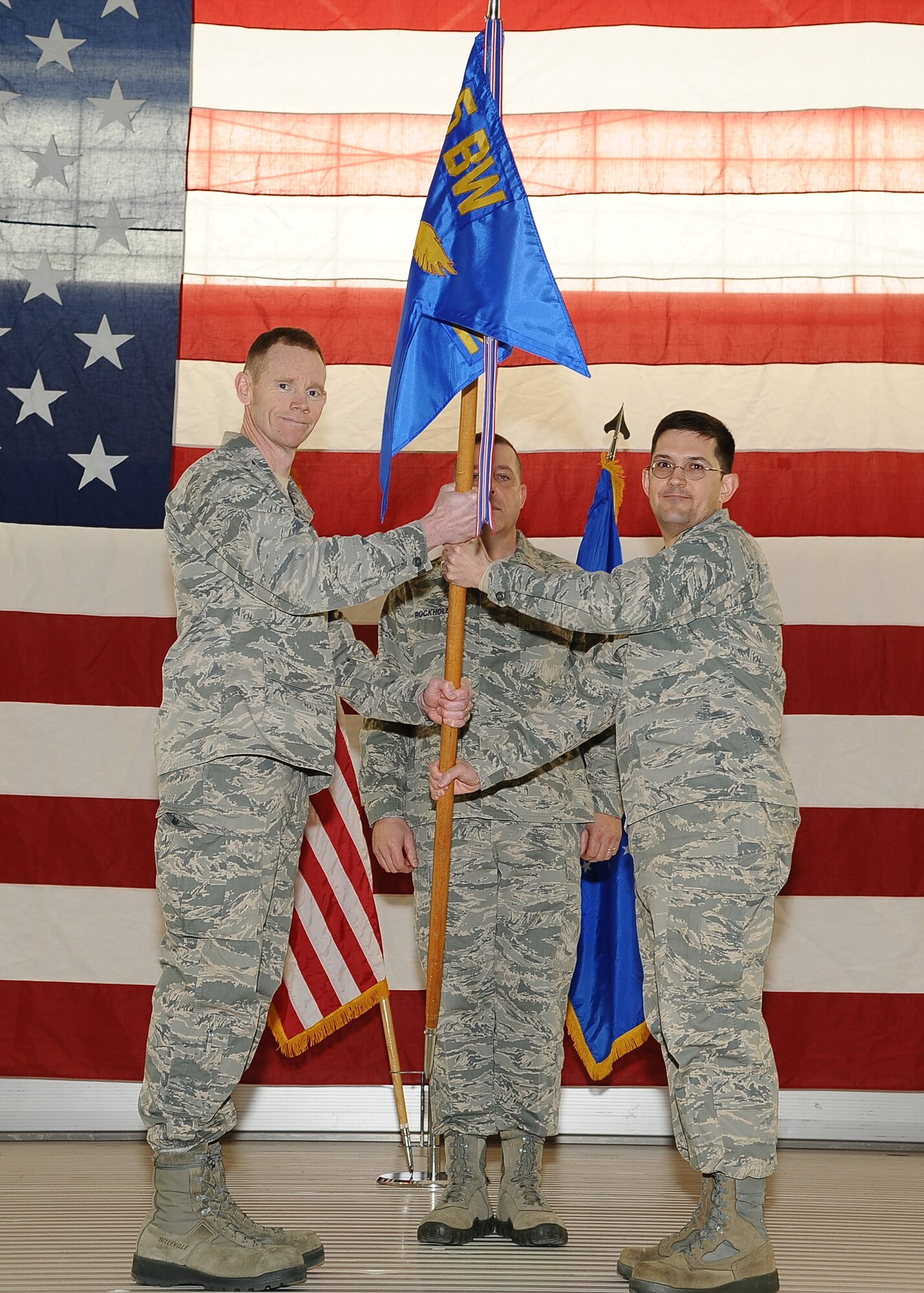 MINOT AIR FORCE BASE, N.D. – Col. James Dawkins Jr., 5th Bomb Wing commander, turns over command of the 5th Mission Support Group to Col. William Mazzeno during an assumption of command ceremony here Feb. 24. (U.S. Air Force photo/Airman 1st Class Kristoffer Kaubisch)

