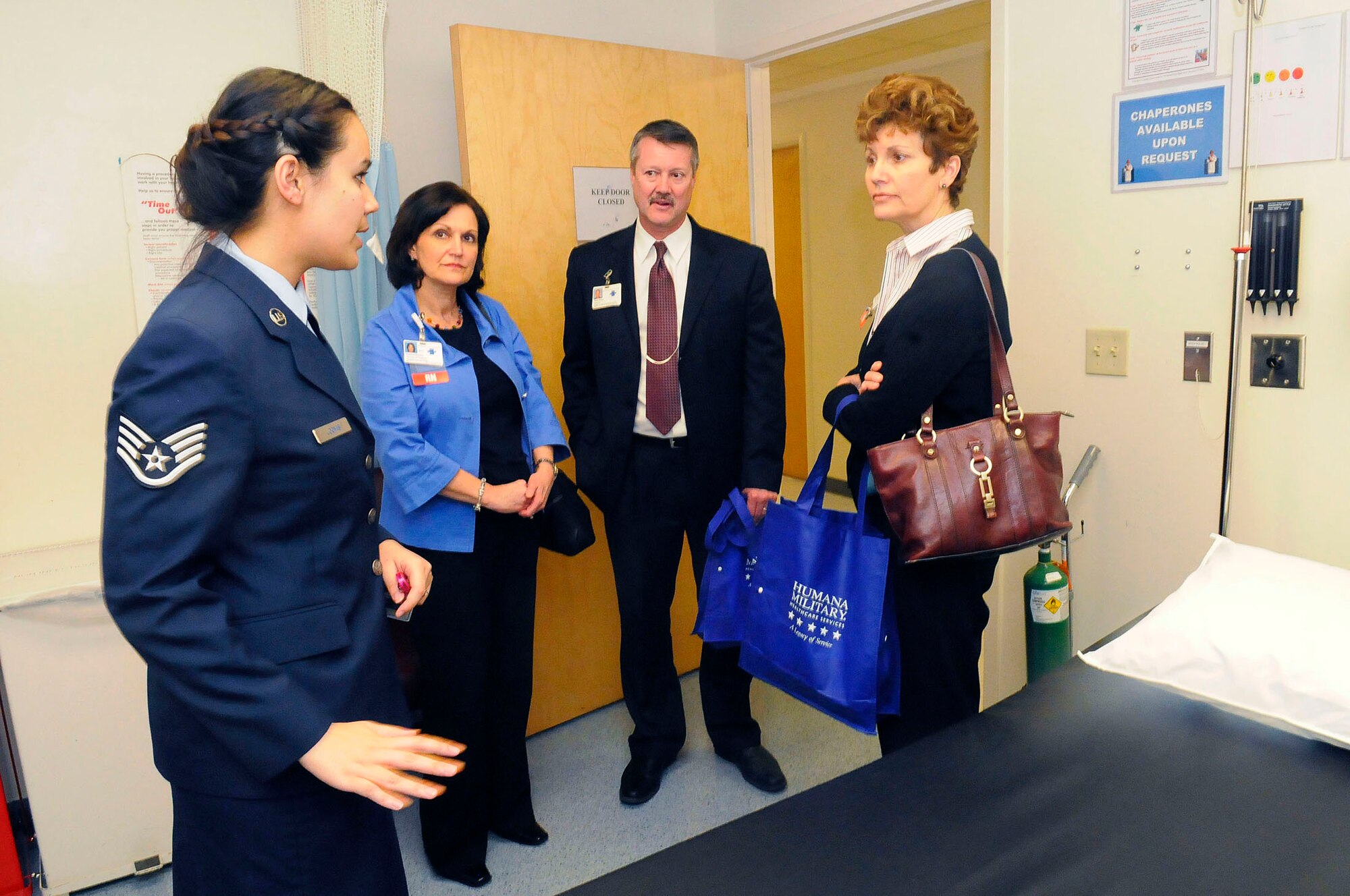 SSgt. Tabatha Loomis, 78th MDOS medical technician,shows an examination room in the family practice clinic to  Laura Gentry, Houston Healthcare director of nursing,Tim Sisco, Houston Healthcare Cardio Vascular Imaging director, and Mindy Hartley, Houston Healthcare patient care vice president. U. S. Air Force photo by Sue Sapp