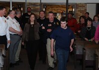 MINOT N.D. -- Marcus Anthony Cox was sworn in as an honorary special agent for his dedication and contributions to the law enforcement community at the First Assembly of God in Minot, Feb. 22. He was presented with a plaque, commemorating the event, by Mr. Peter Edge, Deputy Associate Director of Homeland Security Investigations. Ever since Cox was a young boy, he has always had the love and desire to be a part of the law enforcement community. Although faced with numerous medical challenges which he has overcome, he continues to volunteer his time to support Minot’s emergency services. Marcus’ plans for the future include staying connected to the emergency services and finding a way to actively be a part of helping to take care of people and to help keep them safe. (U.S. Air Force photo/Airman 1st Class Kristoffer Kaubisch)