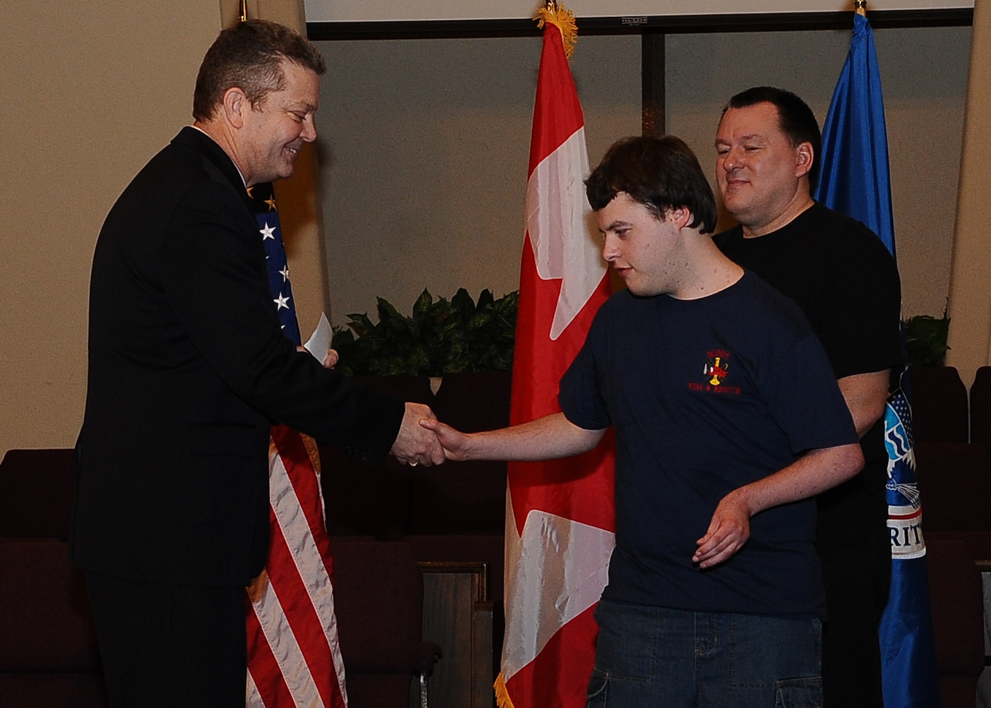 MINOT N.D. -- Marcus Anthony Cox was sworn in as an honorary special agent for his dedication and contributions to the law enforcement community at the First Assembly of God in Minot, Feb. 22. He was presented with a plaque, commemorating the event, by Mr. Peter Edge, Deputy Associate Director of Homeland Security Investigations. Ever since Cox was a young boy, he has always had the love and desire to be a part of the law enforcement community. Although faced with numerous medical challenges which he has overcome, he continues to volunteer his time to support Minot’s emergency services. Marcus’ plans for the future include staying connected to the emergency services and finding a way to actively be a part of helping to take care of people and to help keep them safe. (U.S. Air Force photo/Airman 1st Class Kristoffer Kaubisch)