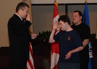MINOT N.D. -- Marcus Anthony Cox was sworn in as an honorary special agent for his dedication and contributions to the law enforcement community at the First Assembly of God in Minot, Feb. 22. He was presented with a plaque, commemorating the event, by Mr. Peter Edge, Deputy Associate Director of Homeland Security Investigations. Ever since Cox was a young boy, he has always had the love and desire to be a part of the law enforcement community. Although faced with numerous medical challenges which he has overcome, he continues to volunteer his time to support Minot’s emergency services. Marcus’ plans for the future include staying connected to the emergency services and finding a way to actively be a part of helping to take care of people and to help keep them safe. (U.S. Air Force photo/Airman 1st Class Kristoffer Kaubisch)