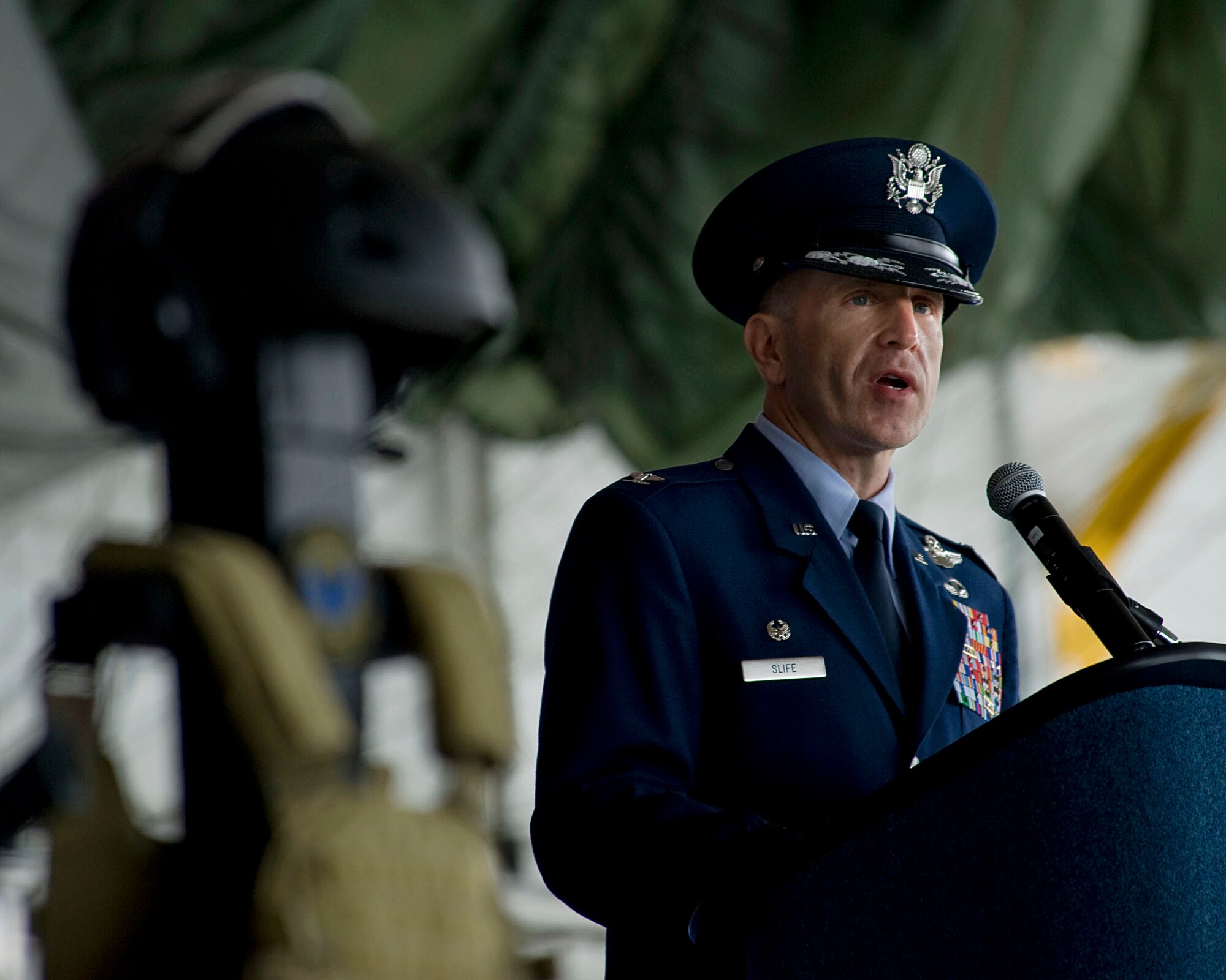 U.S. Air Force Col. Jim Slife, commander of the 1st Special Operations Wing, gives remarks during a ceremony honoring the service and contributions of four fallen Airmen, Hurlburt Field, Fla., Feb. 28, 2012. The ceremony honored the lives of Capt. Ryan P. Hall from the 319th Special Operations Squadron, Capt. Nicholas S. Whitlock and 1st Lt. Justin J. Wilkens from the 34th Special Operations Squadron and Senior Airman Julian S. Scholten from the 25th Intelligence Squadron who all died in a Feb. 18, 2012, U-28A crash in Djibouti, Africa.  (U.S. Air Force photo/Staff Sgt. Vanessa Valentine)(Released)