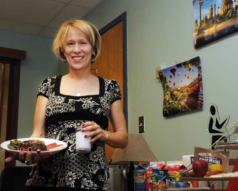 ALTUS AIR FORCE BASE, Okla. – Tara Beth Johnson, 97th Medical Group health promotion dietician, poses for a photo in her office Feb. 29, 2012. Johnson is the new full time dietician on base. March is National Nutrition month and Johnson is planning to be at the Commissary every Wednesday around lunch time, hosting events about nutrition. She plans on having a different theme for each week of the month. Her office is located inside the Health and Wellness Center and she can be contacted at 481-5013. (U.S. Air Force photo by Airman 1st Class Kenneth W. Norman / Released / 97th Air Mobility Wing Public Affairs)