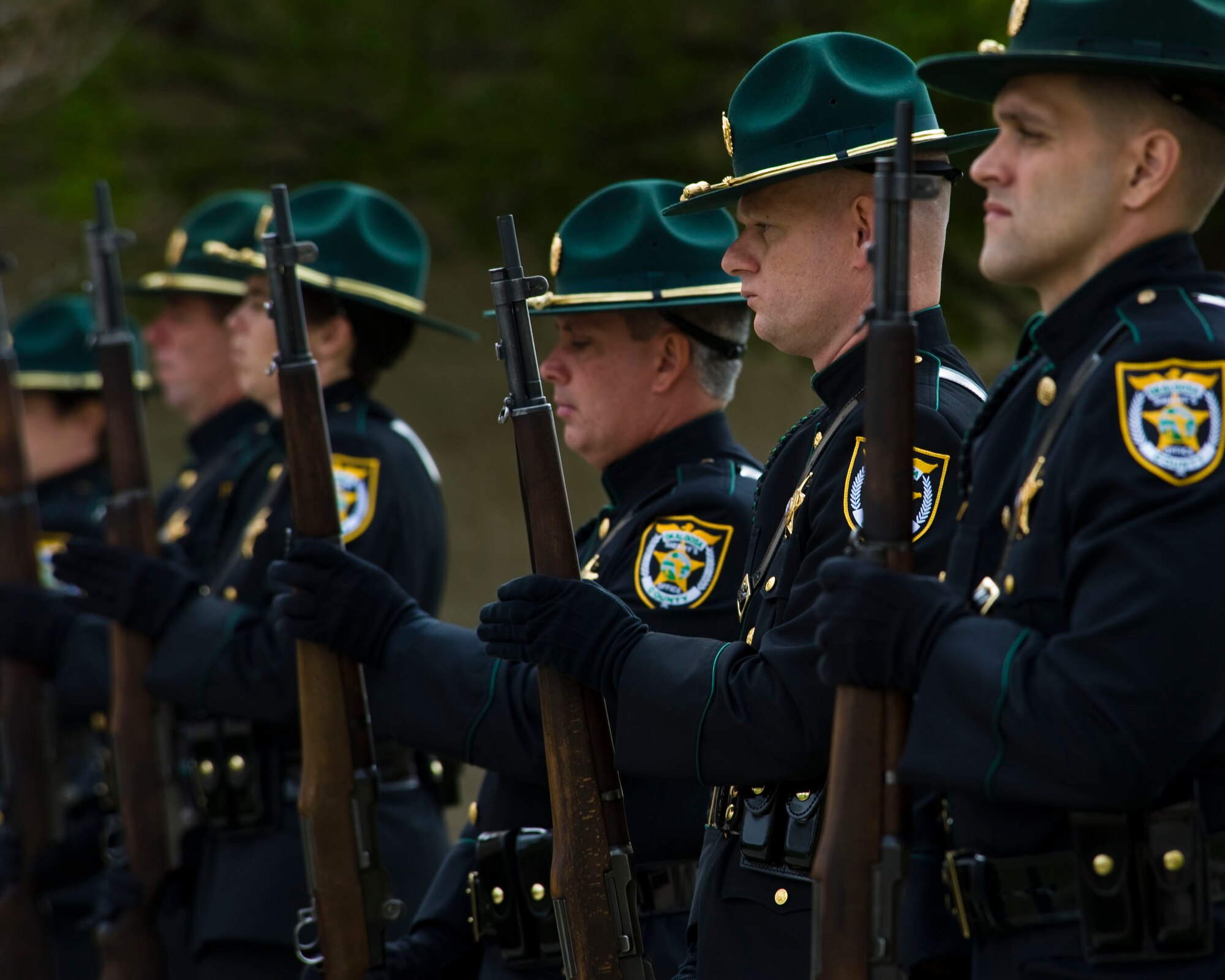 The Okaloosa County Sheriff’s honor guard pay their final respects to four Airmen who have given the ultimate sacrifice at a ceremony held at Hurlburt Field, Fla., Feb. 28, 2012. The memorial ceremony honored the lives of Capt. Ryan P. Hall from the 319th Special Operations Squadron, Capt. Nicholas S. Whitlock and 1st Lt. Justin J. Wilkens from the 34th Special Operations Squadron and Senior Airman Julian S. Scholten from the 25th Intelligence Squadron who all died in a Feb. 18, 2012, U-28A crash in Djibouti, Africa. (U.S. Air Force photo/Staff Sgt. Vanessa Valentine)(Released)
