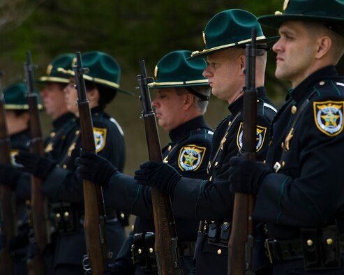 The Okaloosa County Sheriff’s honor guard pay their final respects to four Airmen who have given the ultimate sacrifice at a ceremony held at Hurlburt Field, Fla., Feb. 28, 2012. The memorial ceremony honored the lives of Capt. Ryan P. Hall from the 319th Special Operations Squadron, Capt. Nicholas S. Whitlock and 1st Lt. Justin J. Wilkens from the 34th Special Operations Squadron and Senior Airman Julian S. Scholten from the 25th Intelligence Squadron who all died in a Feb. 18, 2012, U-28A crash in Djibouti, Africa. (U.S. Air Force photo/Staff Sgt. Vanessa Valentine)(Released)