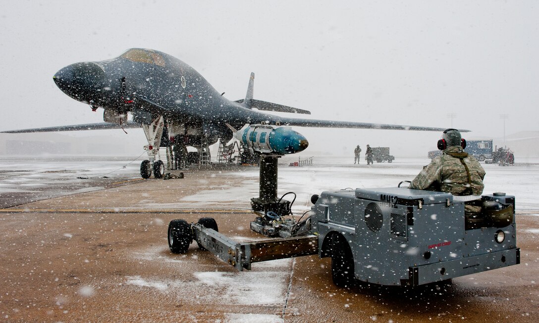 Senior Airman Jason Ellis, 28th Aircraft Maintenance Squadron weapons load crew member, waits to load munitions on to a B-1 bomber during an Operational Readiness Exercise at Ellsworth Air Force Base, S.D., Feb. 24, 2012. The ORE covered a wide range of B-1B operations designed to test Airmen’s abilities to deliver precision and non-precision air strikes against enemy forces anywhere in the world. (U.S. Air Force photo by Airman 1st Class Kate Thornton/Released)
