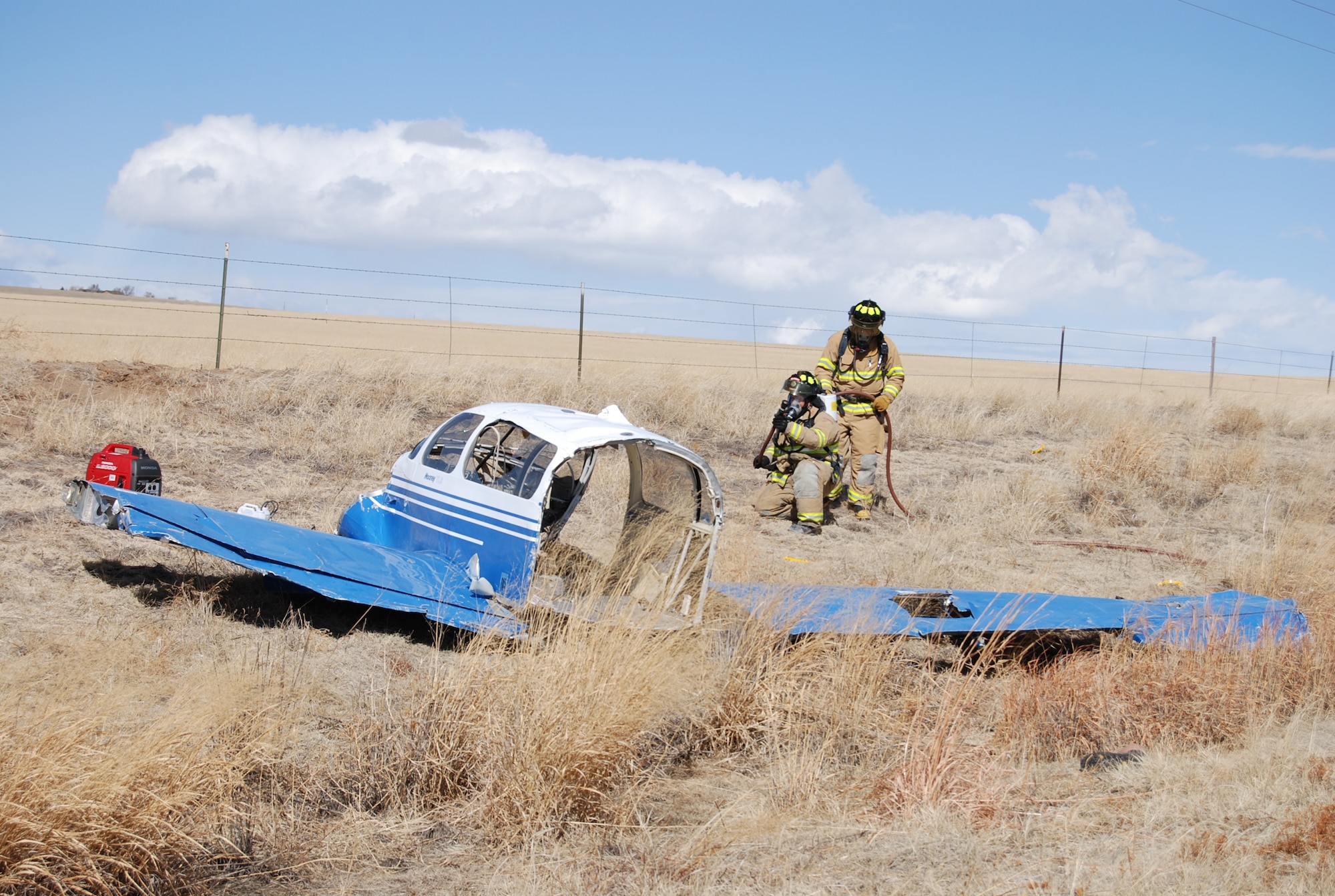 SCHRIEVER AIR FORCE BASE, Colo. — Emergency responders from Peterson and Schriever Air Force Bases responded to a simulated aircraft crash near the Schriever AFB west gate as part of the Condor Crest readiness exercise Feb. 28, 2012. The Schriever fire department, Ellicott, Colo., fire and rescue, and the Peterson fire department were among the first responders to the scene. The purpose of the exercise is to train and educate Air Force personnel to respond to crises and defend the installation. (U.S. Air Force photo/Lea Johnson)