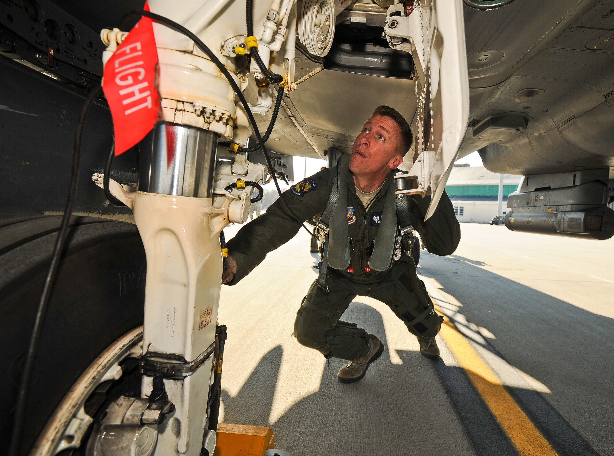 U.S. Air Force Col. Patrick Doherty performs a pre-flight inspection prior to returning to Seymour Johnson Air Force Base, N.C., from exercise Global Guardian 2012 at the National Guard Combat Readiness Training Center in Savannah, Ga., Feb. 22, 2012. Global Guardian is an annual Air National Guard sponsored training exercise emphasizing full spectrum operations while providing personnel and units an opportunity to participate at a simulated deployed Joint Expeditionary Wing. Doherty, 4th Fighter Wing commander, hails from Bellevue, Neb. (U.S. Air Force photo/Master Sgt. Roger Parsons/Released)