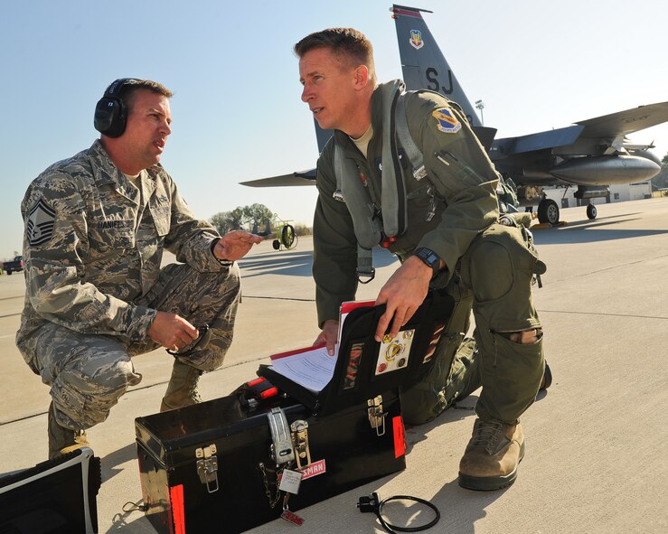 U.S. Air Force Senior Master Sgt. Allen Daniels briefs Col. Patrick Doherty of the 4th Fighter Wing’s performance during exercise Global Guardian 2012 at the National Guard Combat Readiness Training Center in Savannah, Ga., Feb. 22, 2012. Doherty traveled to the training center to observe the exercise and receive a tour of the facility. Daniels, 333rd Aircraft Maintenance Unit superintendent, is from Springfield, Maine. Doherty, 4th FW commander, hails from Bellevue, Neb. (U.S. Air Force photo/Master Sgt. Roger Parsons/Released)