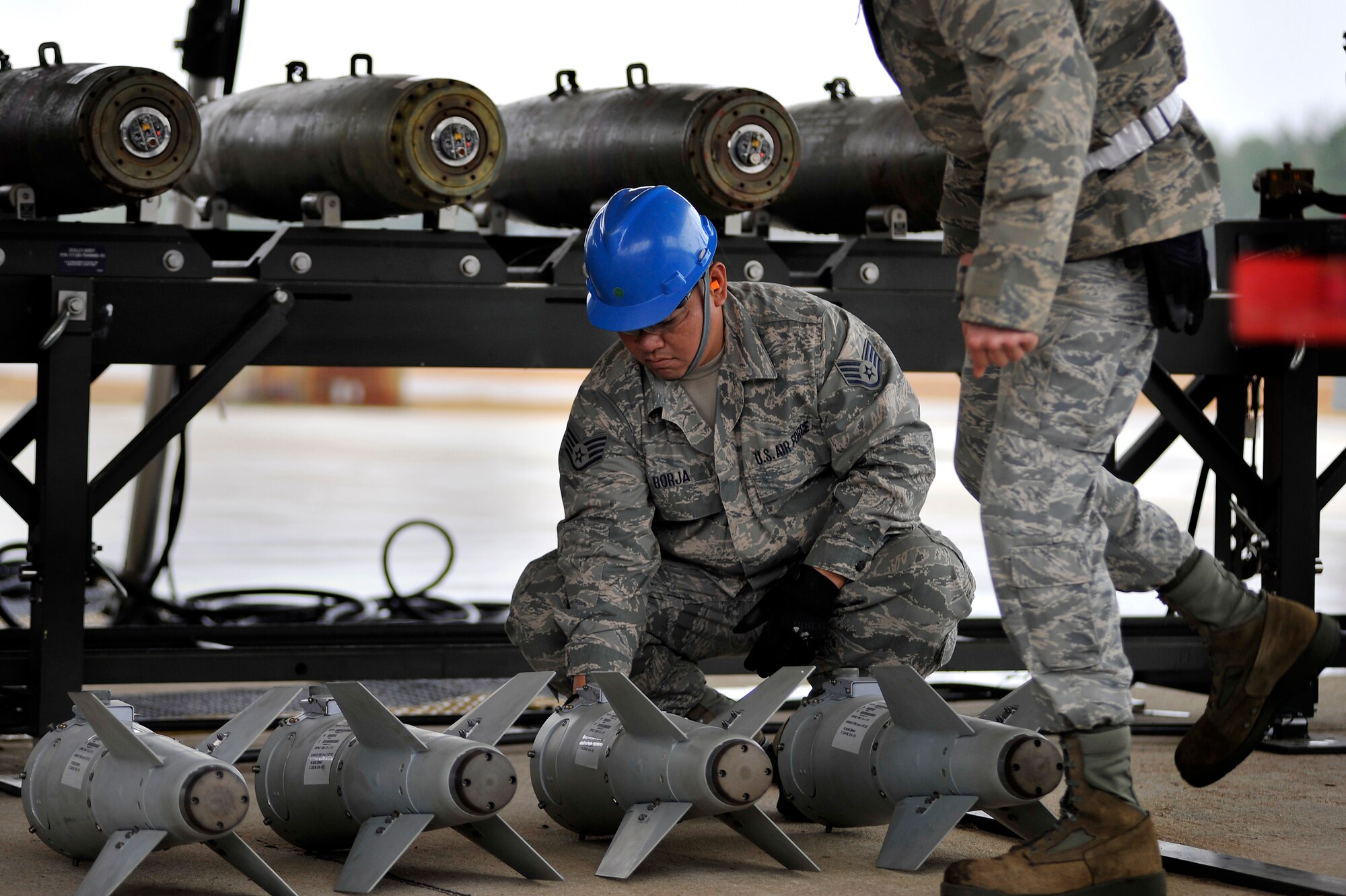 U.S. Air Force Staff Sgt. Juan Borja, 20th Equipment Maintenance Squadron munitions flight, sorts components to inert guided bomb units before assembling the weapons, Feb. 27, 2012, Shaw Air Force Base, S.C. The weapons were assembled in preparation for an upcoming Operational Readiness Exercise. (U.S. Air Force photo by Senior Airman Kenny Holston/Released)

