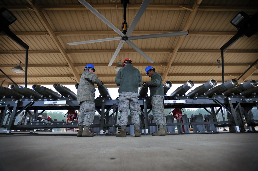 U.S. Air Force Airmen assigned to the 20th Equipment Maintenance Squadron munitions flight assemble to inert guided bomb units, Feb. 27, 2012, Shaw Air Force Base, S.C. The weapons were assembled in preparation for an upcoming Operational Readiness Exercise. (U.S. Air Force photo by Senior Airman Kenny Holston/Released)