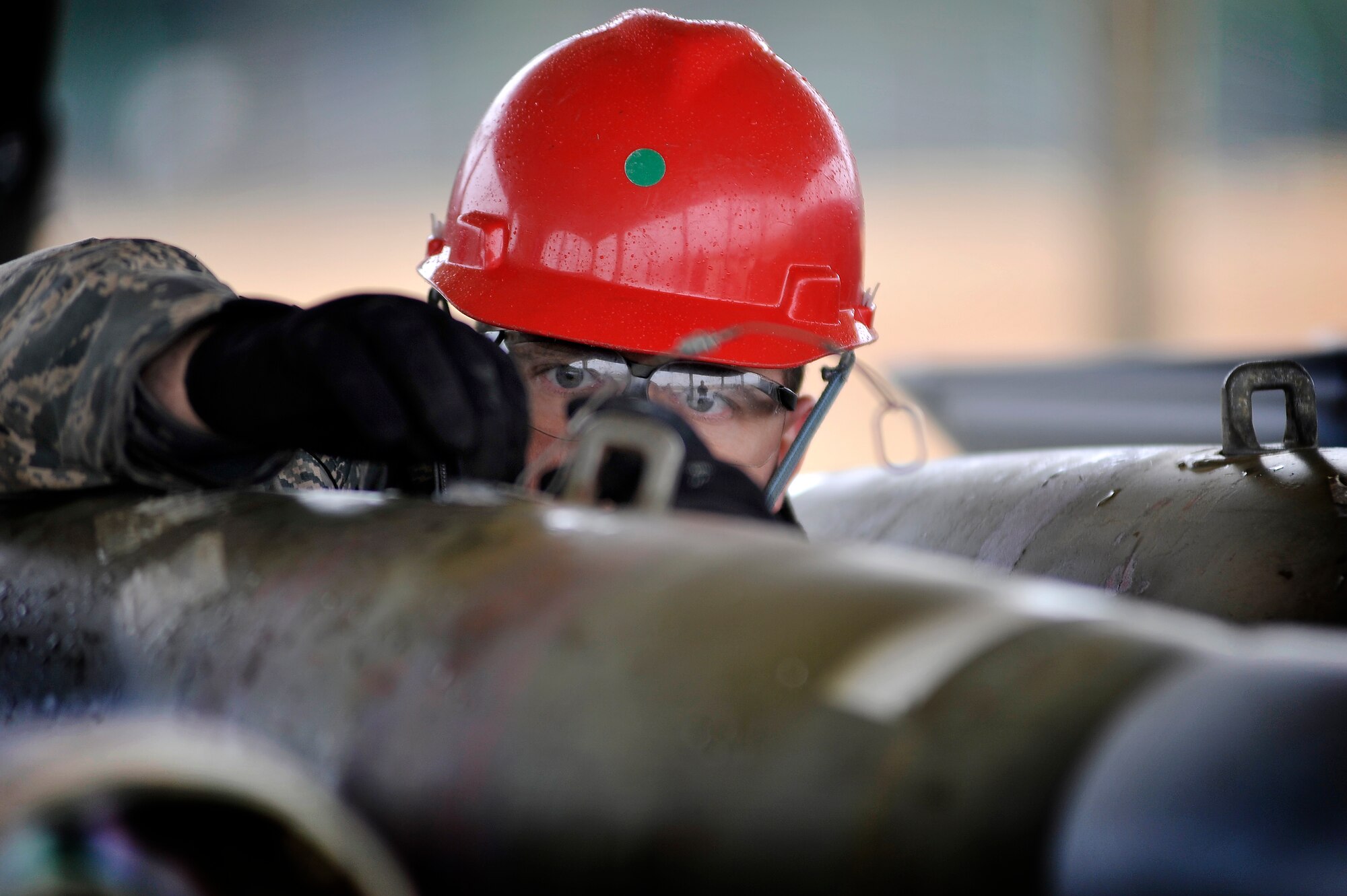 U.S. Air Force Tech. Sgt. David Coughtry, 20th Equipment Maintenance Squadron munitions flight, carefully assembles an inert guided bomb unit, Feb. 27, 2012, Shaw Air Force Base, S.C. The weapons were assembled in preparation for an upcoming Operational Readiness Exercise. (U.S. Air Force photo by Senior Airman Kenny Holston/Released)

