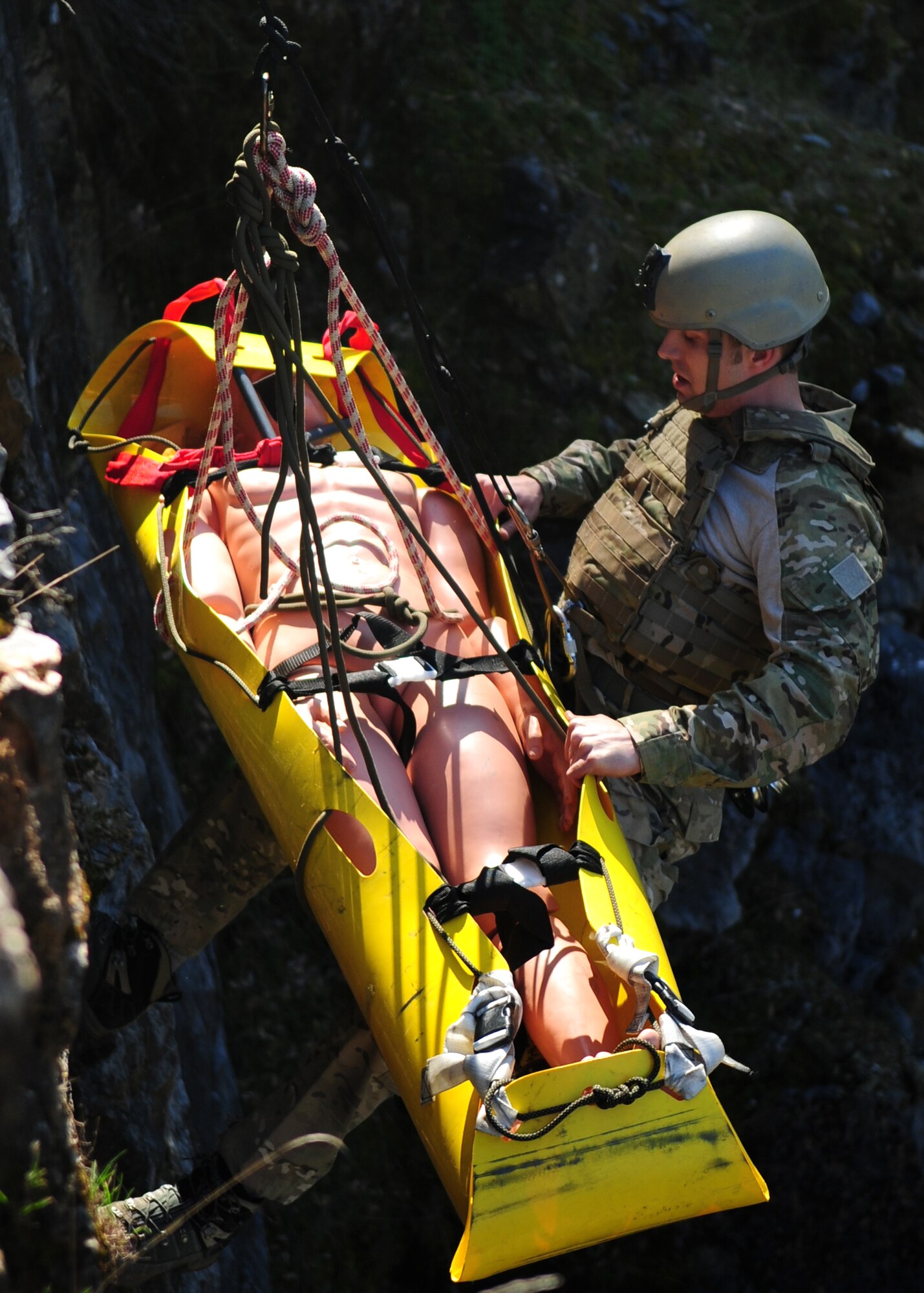 Staff Sgt. Scott Love, 9th Civil Engineer Squadron explosive ordnance disposal technician, starts his way down a 200 foot cliff during mountain warfare training in Auburn, Calif., Feb. 17, 2012. The EOD flight here stays proficient in mountain warfare training to handle various situations such as this. (U.S. Air Force photo by Senior Airman Shawn Nickel/Released)