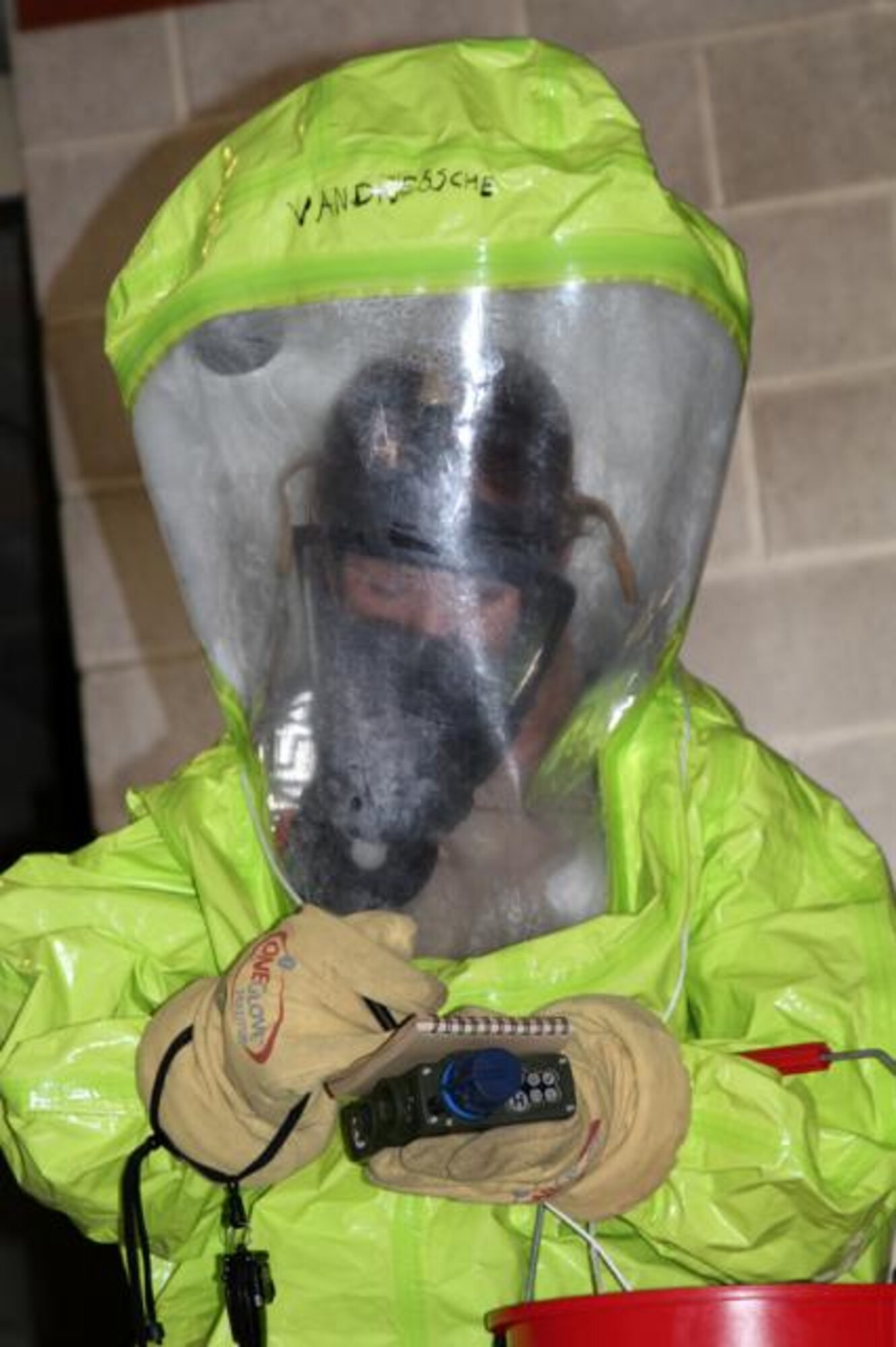 SSgt. Beth Vandriessche wears a Level A HAZMAT Suit while using a Joint Chemical Agent Detector at the Georgia National Guard Combat Readiness Training Center, Feb. 19, 2012. Vandriessche, a member of the 127th Civil Engineer Squadron at Selfridge Air National Guard Base, Mich., was performing a Sensitive Site Assessment after a simulated chemical weapons attack during the Global Guardian training exercise, Feb. 13-24. During the exercise, more than 1,300 Soldiers and Airmen of the National Guard, as well as members of the Royal Netherland Air Force and Canadian Air Force, trained to respond to a terrorist attack or natural disaster in the U.S. Approximately a half dozen Airmen from Selfridge participated in the exercise, which included military personnel from more than 20 states. In addition to allowing the participating personnel to work on their individual skills, the exercise provided an opportunity for team building across the various units of the National Guard. (U.S. Air Force photo by TSgt Jaclyn Carver)