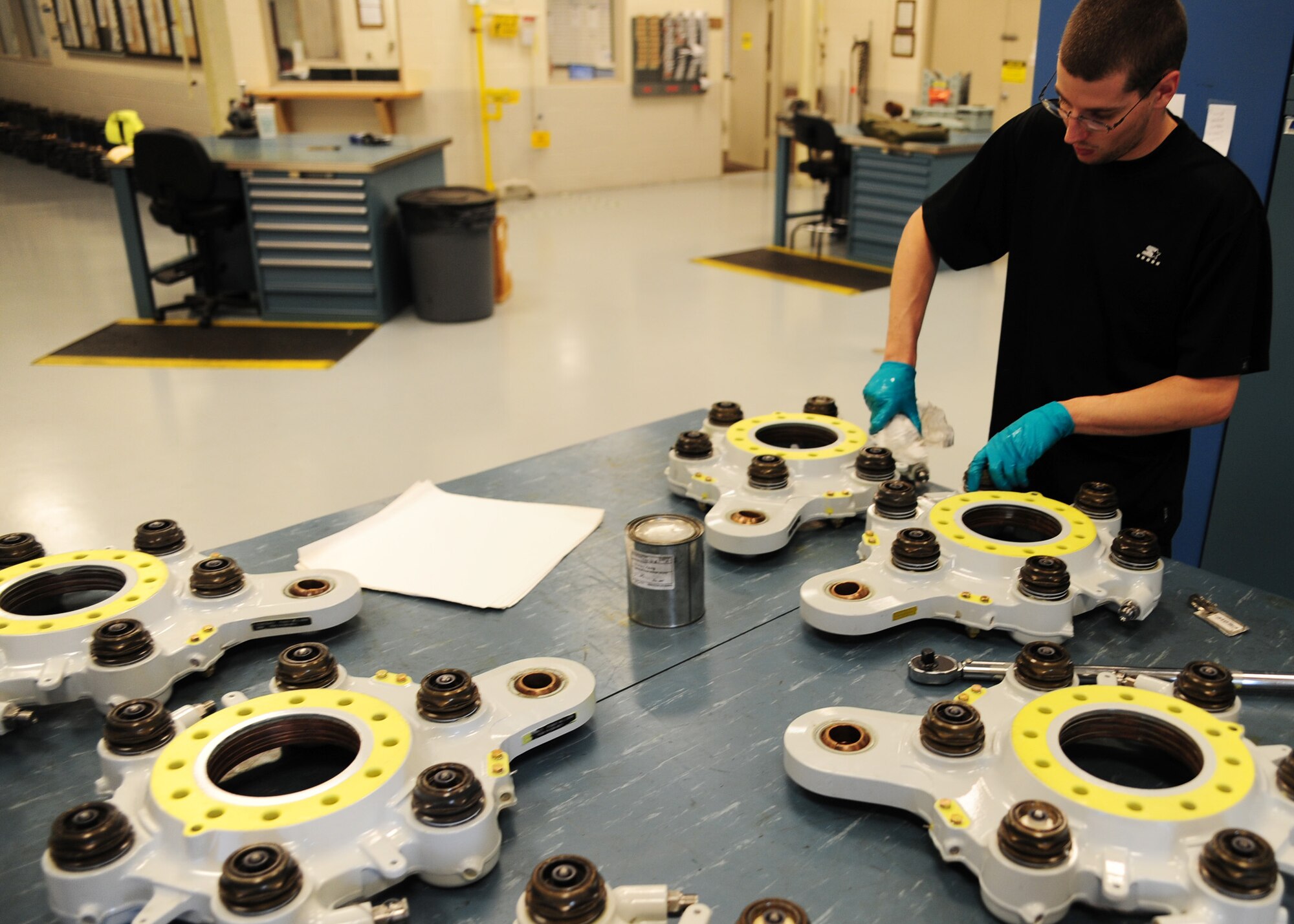 Keith Antonacci cleans fluid off of brakes during build up at Joint Base Charleston - Air Base Feb. 23. Approximately 30 brakes are overhauled each month by the  hydraulics shop to ensure better performance. Antonacci is a 437th Maintenance Squadron hydraulic technician,437th Airlift Wing. (U.S. Air Force photo/Staff Sgt. Katie Gieratz)