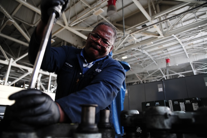 Norman Riley removes a quick disconnect plug from a brake at Joint Base Charleston - Air Base Feb. 23. The plugs are removed so the brakes can be overhauled for better performance. Riley is a 437th Maintenance Squadron aircraft hydraulics technician, 437th Airlift Wing. (U.S. Air Force photo/Staff Sgt. Katie Gieratz)

