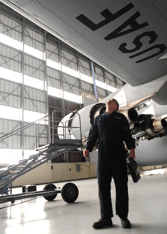 Staff Sgt. Justin Diggins performs a routine inspection for hydraulic fluid leaks on a C-17 Globemaster III at the Home Station Check hangar at Joint Base Charleston - Air Base Feb. 21. The aircraft is monitored regularly to ensure all hoses and valves containing hydraulic fluid are in proper working condition. Diggins is a 437th Maintenance Squadron aircraft hydraulics journeyman, 437th Airlift Wing. (U.S. Air Force photo/Staff Sgt. Katie Gieratz)

