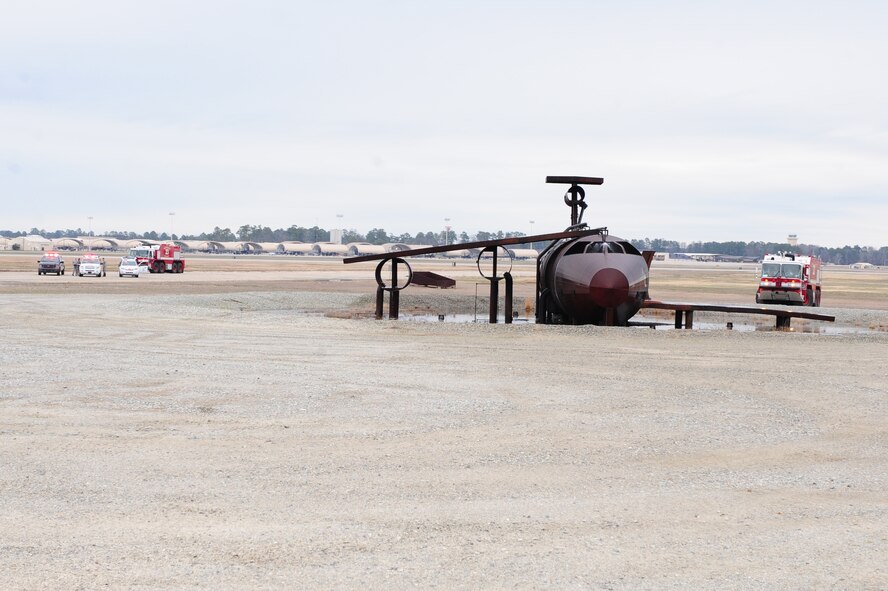 Emergency officials respond to a simulated nuclear-laden aircraft after an emergency landing on the flightline during a major accident response exercise on Seymour Johnson Air Force Base, N.C., Feb. 28, 2012. The purpose of the exercise was to evaluate how on-base emergency reponders react to a major aircraft accident involving nuclear weapons. (U.S. Air Force photo/Airman 1st Class Mariah Tolbert/Released)