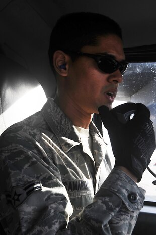 Airman 1st Class Michael Camarillo, fuels distribution apprentice, 99th Logistics Readiness Squadron, contacts the control tower for permission to cross the restricted area boundary Feb. 23rd, 2012 at Nellis Air Force Base, Nev. The Fuels Management Flight, responsible for fueling all aircraft at Nellis AFB, accomplishes its mission daily regardless of condition or number of airframes serviced. (U.S. Air Force photo by Senior Airman Jack Sanders)