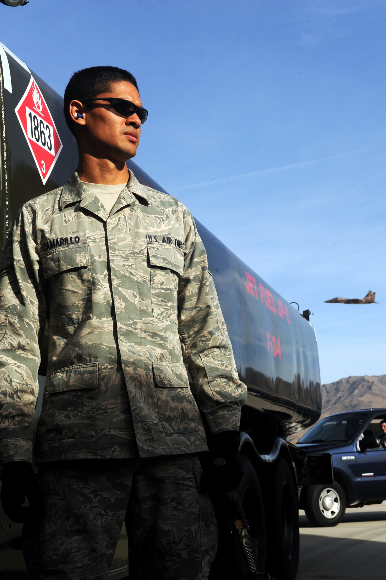 Airman 1st Class Michael Camarillo, fuels distribution apprentice, 99th Logistics Readiness Squadron, fuels a C-130 Hercules Feb. 23rd, 2012 at Nellis Air Force Base, Nev. The Fuels Management Flight, responsible for fueling all aircraft at Nellis AFB, accomplishes its mission daily regardless of condition or number of airframes serviced. (U.S. Air Force photo by Senior Airman Jack Sanders)