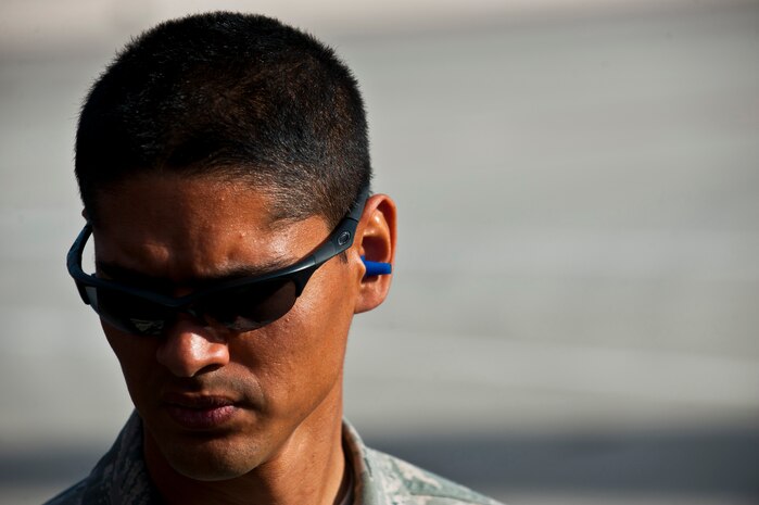 Airman 1st Class Michael Camarillo, fuels distribution apprentice, 99th Logistics Readiness Squadron, looks at the fuel flow Feb. 23rd, 2012 at Nellis Air Force Base, Nev. The Fuels Management Flight, responsible for fueling all aircraft at Nellis AFB, accomplishes its mission daily regardless of condition or number of airframes serviced. (U.S. Air Force photo by Senior Airman Brett Clashman)