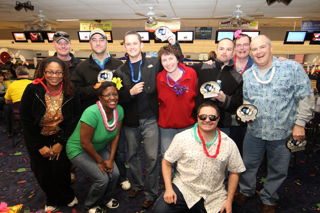 It's time to celebrate teamwork!  Members of the 932nd Maintenance Group enjoyed winning the Rising Six bowling tournament recently at the 932nd Airlift Wing.  Congratulations to all the teams who entered and helped raise money through a fun evening at the base bowling alley.  (U.S. Air Force photo/Tech. Sgt. Chris Parr)