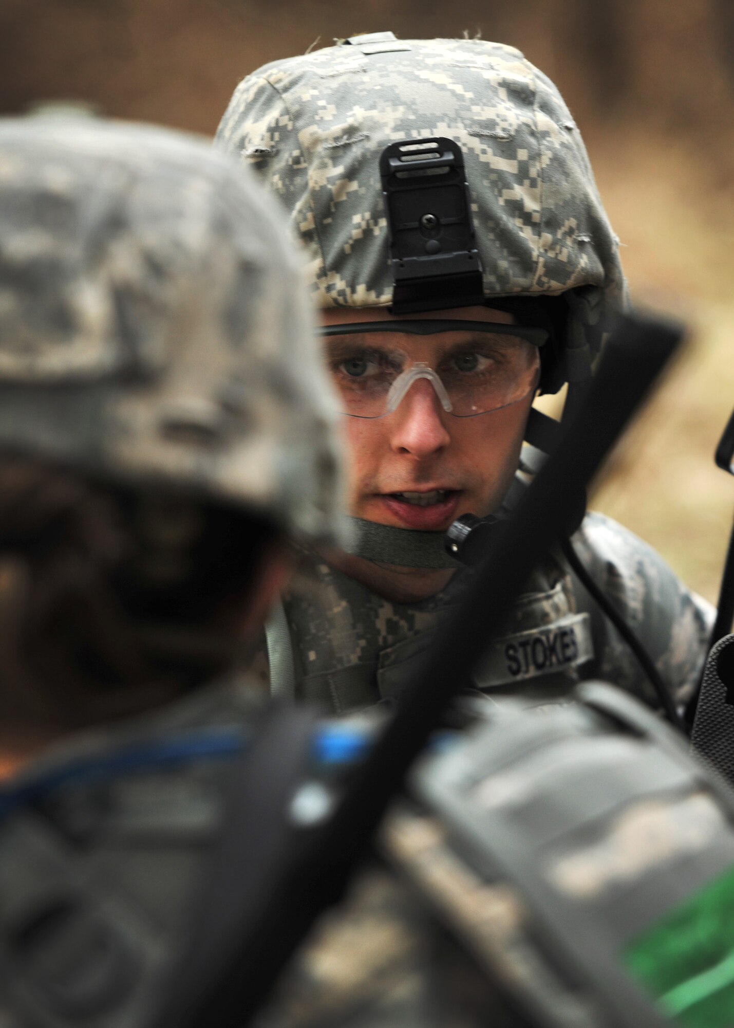 NORFOLK, England – Tech. Sgt. Brian Stokes, 100th Security Forces Squadron, speaks to one of his fire team leads during a simulated deployment mission at Stanford Training Area, Norfolk, Feb. 28, 2012. The Airmen went through two days of classroom instruction beginning Feb. 22 after which they immediately “deployed” to STANTA for four days. (U.S. Air Force photo/Senior Airman Jerilyn Quintanilla)