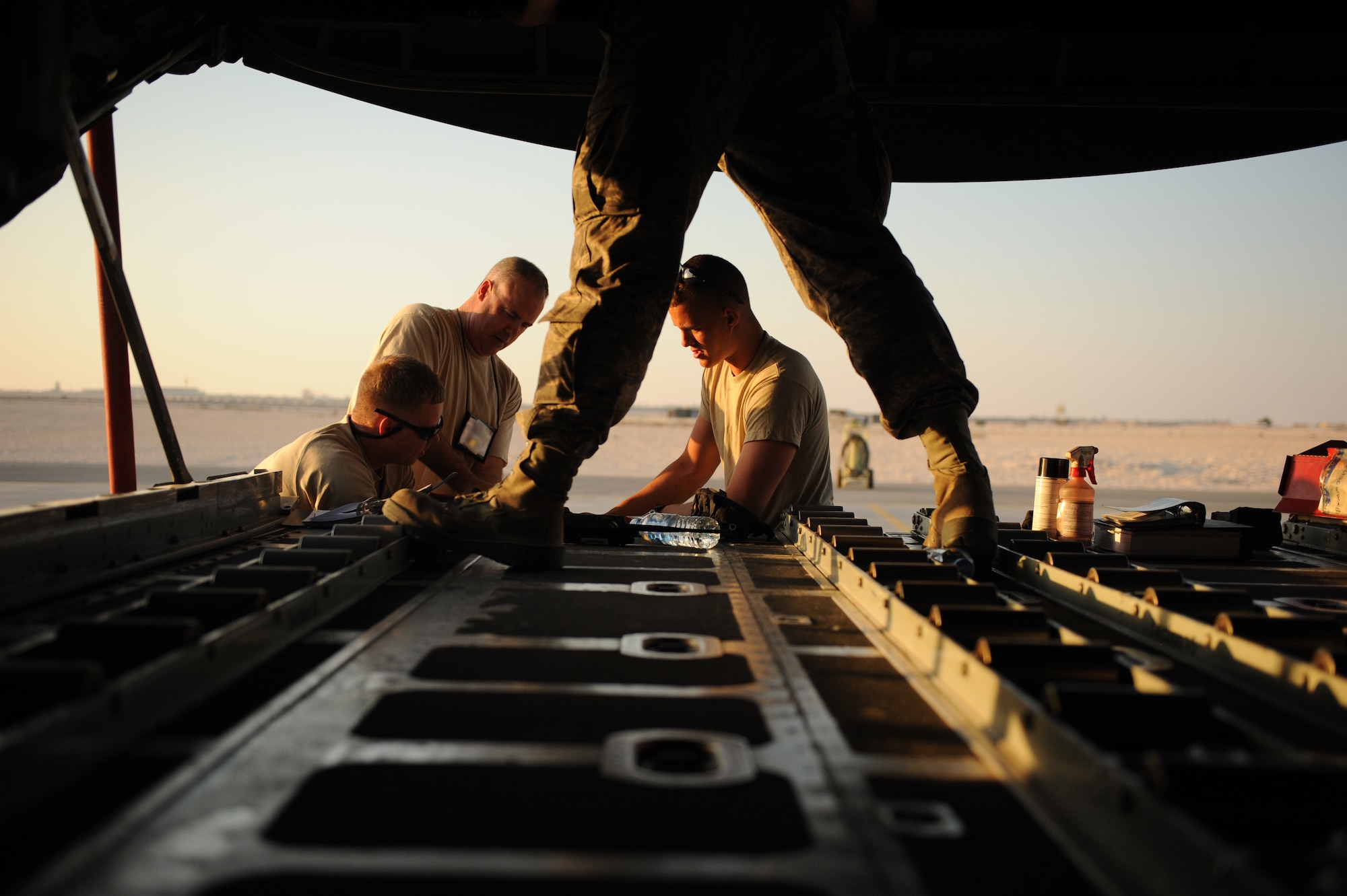 SOUTHWEST ASIA – Maintainers from the 746th Expeditionary Aircraft Maintenance Unit perform maintenance on a flap rod during a home station check here Feb. 28, 2012. The Airmen work on the aircraft 24-hours a day during home station checks to get the C-130 back into operational status as soon as possible. (U.S. Air Force photo/Staff Sgt. Nathanael Callon)
