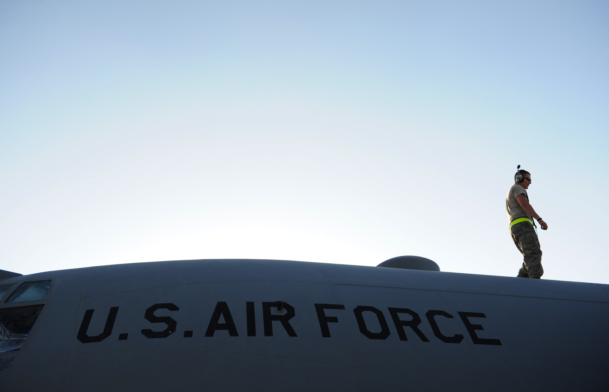 SOUTHWEST ASIA – Staff Sgt. Erik Koski, 746th Expeditionary Aircraft Maintenance Unit C-130 Hercules maintainer, walks on the top of a C-130 to check an engine during a home station check here Feb. 28, 2012. C-130s are able to land on both standard and substandard runways, and can also take off in relatively short distances, which makes it useful for specialized missions. (U.S. Air Force photo/Staff Sgt. Nathanael Callon)