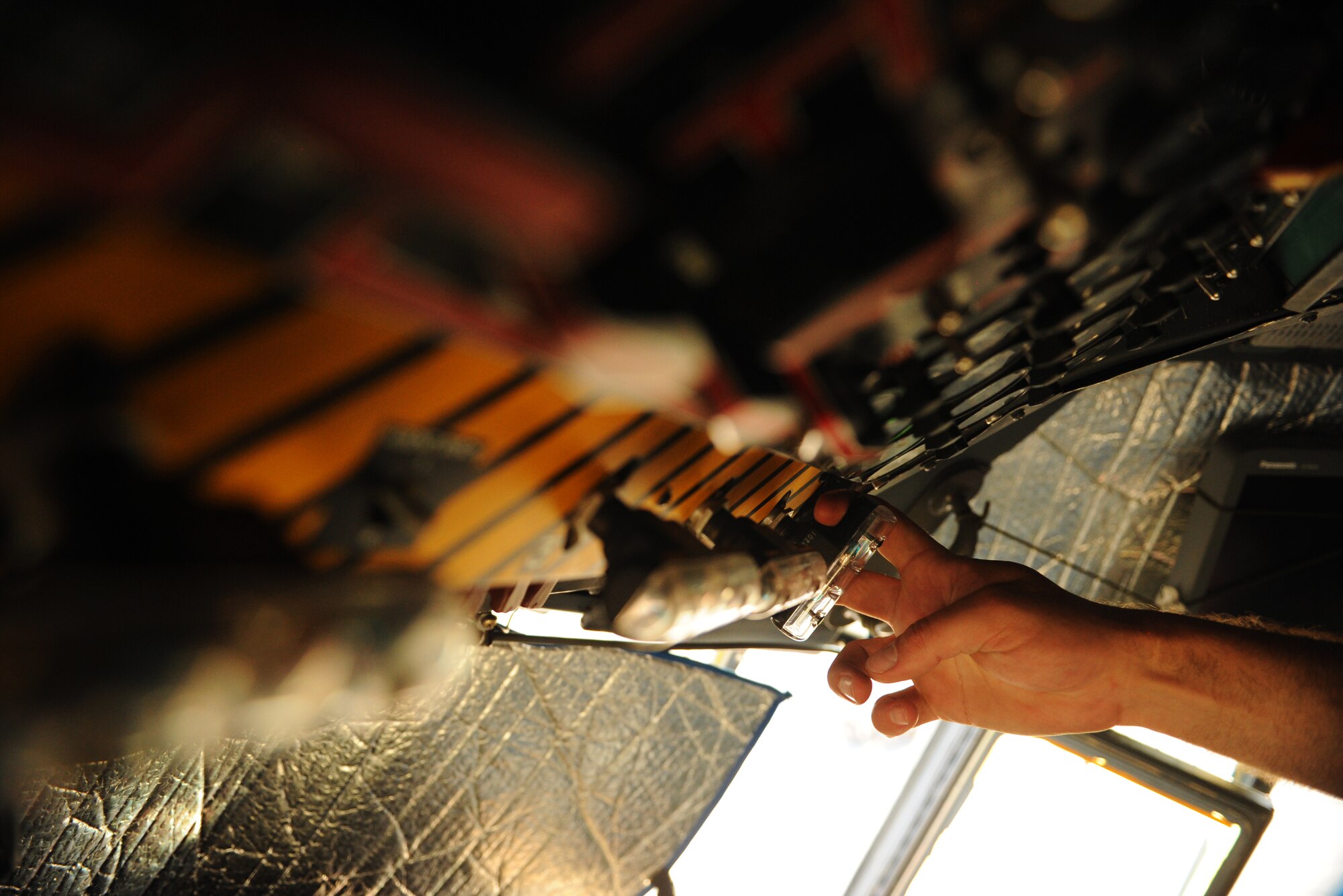 SOUTHWEST ASIA – Senior Airman Andy Schmitz, 746th Expeditionary Aircraft Maintenance Unit electrical and environmental systems specialist and native of Minneapolis, pulls a lever inside the cockpit of a C-130H3 Hercules during a home station check here Feb. 28, 2012. The 746th EAMU has 22 Air Force Reserve Airmen who take care of all of the 746th Expeditionary Airlift Squadron’s C-130s. (U.S. Air Force photo/Staff Sgt. Nathanael Callon)