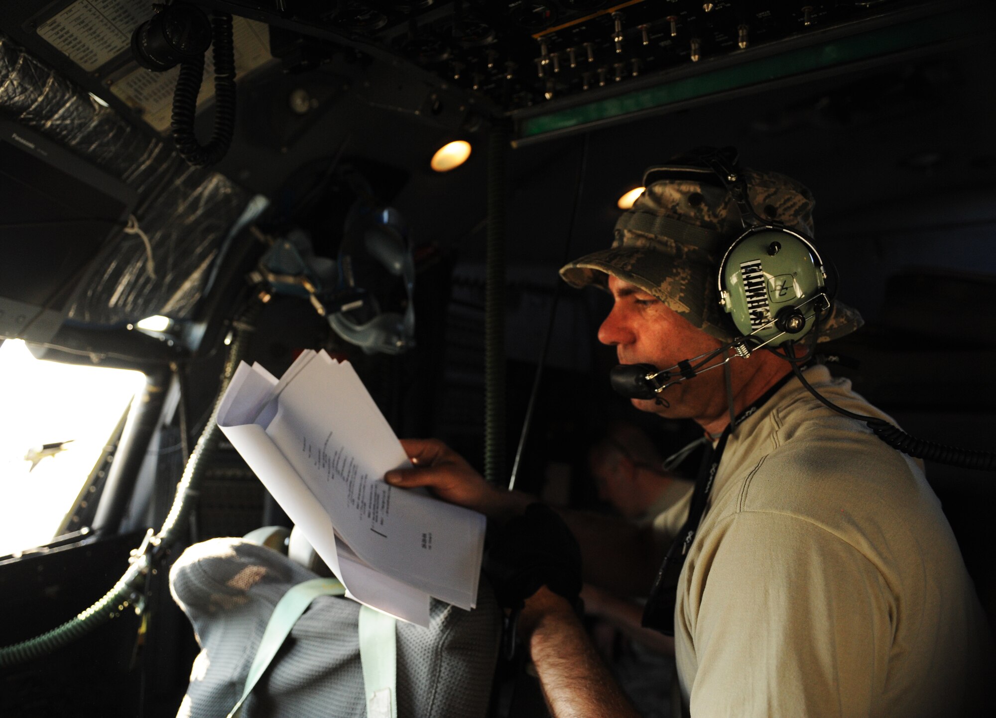 SOUTHWEST ASIA – Senior Airman Andy Schmitz, 746th Expeditionary Aircraft Maintenance Unit electrical and environmental systems specialist and native of Minneapolis, looks over an inspection document inside the cockpit of a C-130H3 Hercules during a home station check here Feb. 28, 2012. In addition to technical orders, which tells maintainers how to specifically perform maintenance on the aircraft, the inspection document specifies what items must be inspected during the home station check. (U.S. Air Force photo/Staff Sgt. Nathanael Callon)