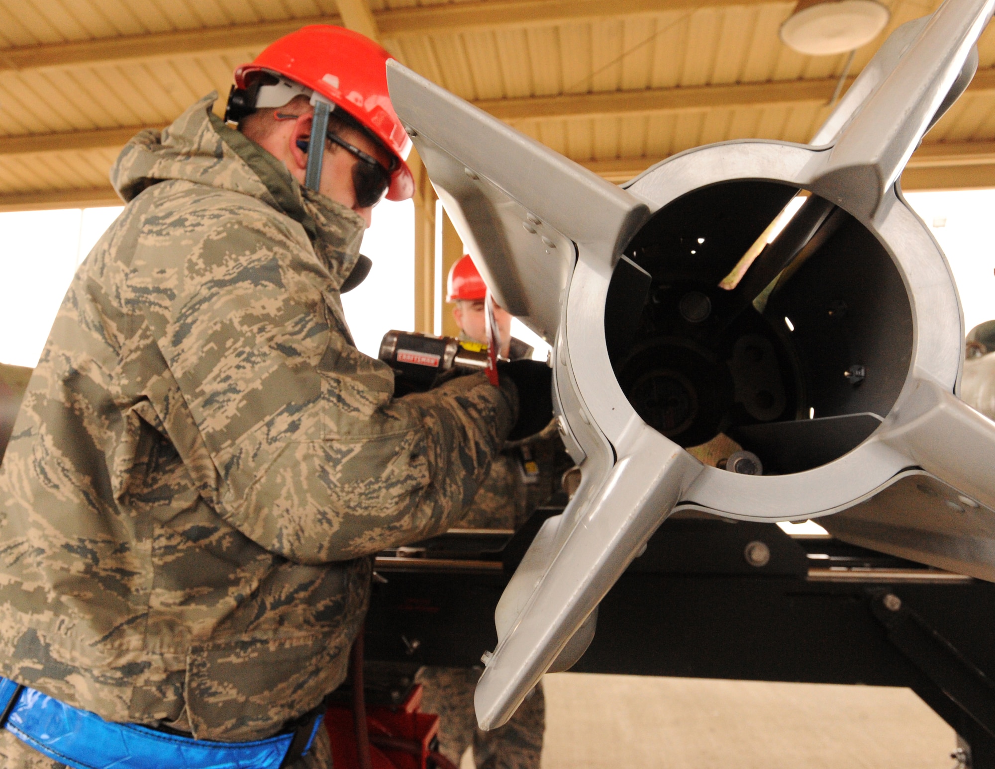 U.S. Air Force Tech. Sgt. Brian Robinson, 20th Equipment Maintenance Squadron munitions flight combat plans and training, bolts the fins of the inert guided bomb unit at Shaw Air Force Base, S.C., Feb. 27, 2012. The 20th EMS munitions flight built inert guided bomb units to load on to Shaw's F-16 Fighting Falcons to demonstrate warlike scenarios for an upcoming Operation Readiness Exercise. (U.S. Air Force photo by Senior Airman Tabatha McCarthy/Released)