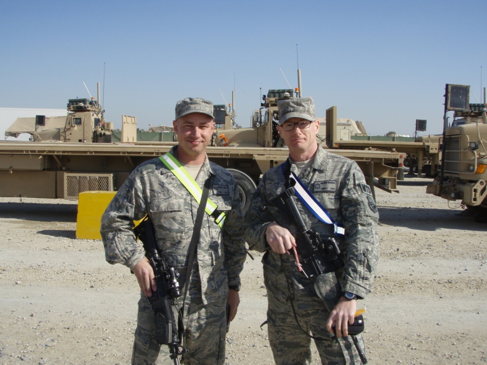 SOUTHWEST ASIA– Tech. Sgt. Joshua Moul, left, a combat convoy commander with a joint logistics task force, stands with Chief Master Sgt. Matthew Wickham, the squadron chief of the 387th Expeditionary Logistics Readiness Squadron, Dec. 4, 2011, prior to departing for a convoy mission to Iraq. Moul, deployed from the 100th Logistics Readiness Squadron at RAF Mildenhall, led convoy missions in support of the U.S. military’s drawdown and departure from Iraq. (courtesy photo) 