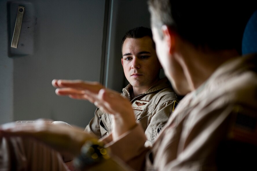 U.S. Air Force Lt. Col. Jeff Whiteman, a KC-10 Extender pilot from the 908th Expeditionary Air Refueling Squadron, mentors 1st Lt. Cody Martin at an undisclosed location in Southwest Asia Feb. 27, 2012. The 908th EARS provides critical air refueling to aircraft in the area of responsibility, delivering more than one million gallons of fuel to the fight every day. In 2011, the 908th EARS offloaded more than 390 million pounds of fuel to more than 28,000 aircraft, flew more than 36,700 hours in almost 4,600 missions. The average sortie length for a KC-10 mission in Southwest Asia is about eight hours. (U.S. Air Force photo by Staff Sgt. Greg Biondo) 