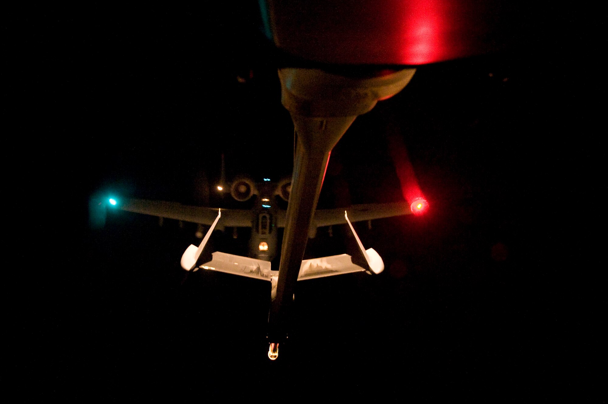A U.S. Air Force A-10 Thunderbolt II receives fuel over Afghanistan from a KC-10 Extender from the 908th Expeditionary Air Refueling Squadron, Feb. 24, 2012. The 908th EARS provides critical air refueling to aircraft in the area of responsibility, delivering more than one million gallons of fuel to the fight every day. In 2011, the 908th EARS offloaded more than 390 million pounds of fuel to more than 28,000 aircraft, and flew more than 36,700 hours in almost 4,600 missions. The average sortie length for a KC-10 mission in Southwest Asia is about eight hours. (U.S. Air Force photo by Staff Sgt. Greg C. Biondo)