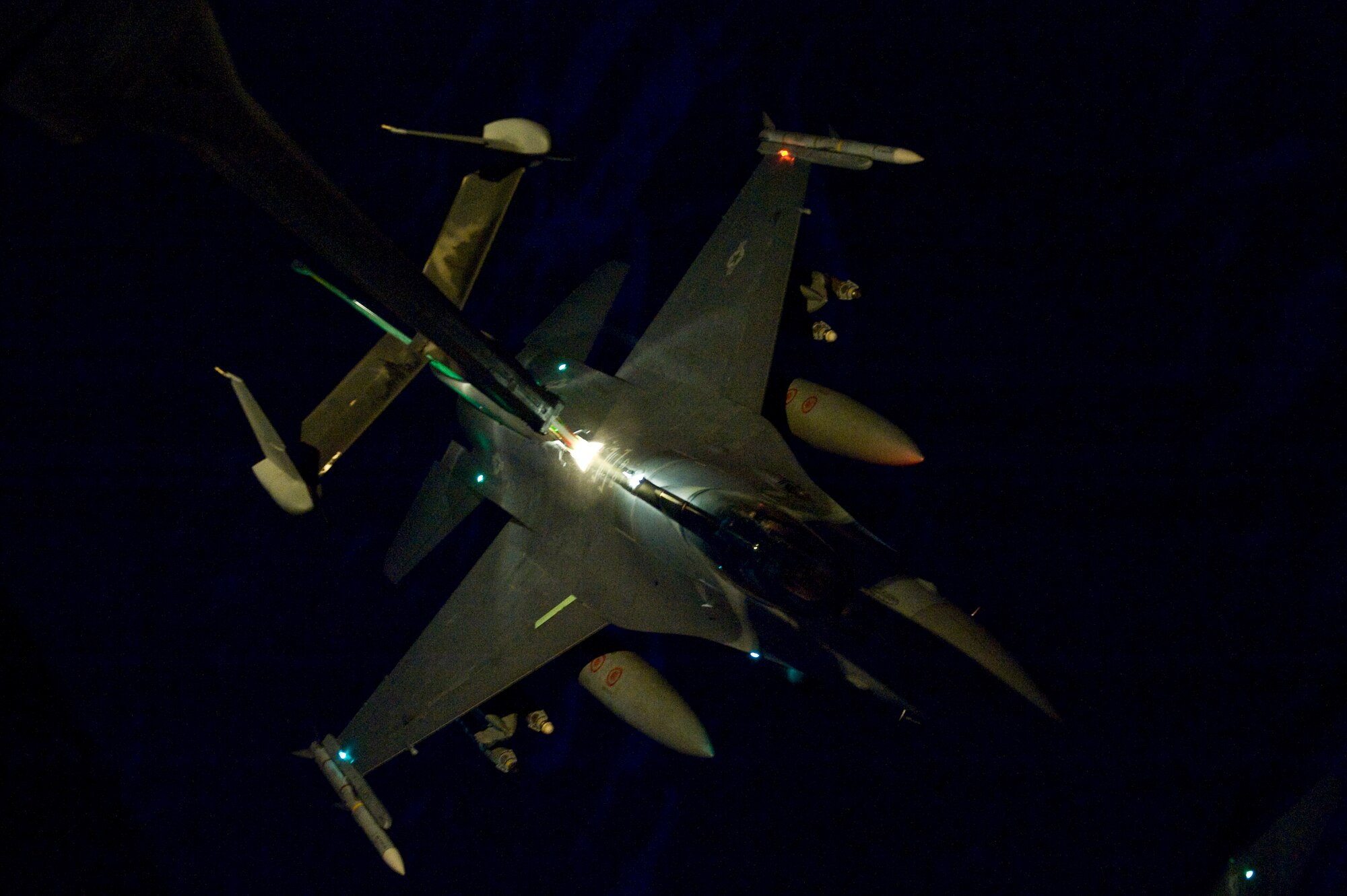 A U.S. Air Force F-16C Fighting Falcon receives fuel over Afghanistan from a KC-10 Extender from the 908th Expeditionary Air Refueling Squadron, Feb. 24, 2012. The 908th EARS provides critical air refueling to aircraft in the area of responsibility, delivering more than one million gallons of fuel to the fight every day. In 2011, the 908th EARS offloaded more than 390 million pounds of fuel to more than 28,000 aircraft, flew more than 36,700 hours in almost 4,600 missions. The average sortie length for a KC-10 mission in Southwest Asia is about eight hours. (U.S. Air Force photo by Staff Sgt. Greg C. Biondo)